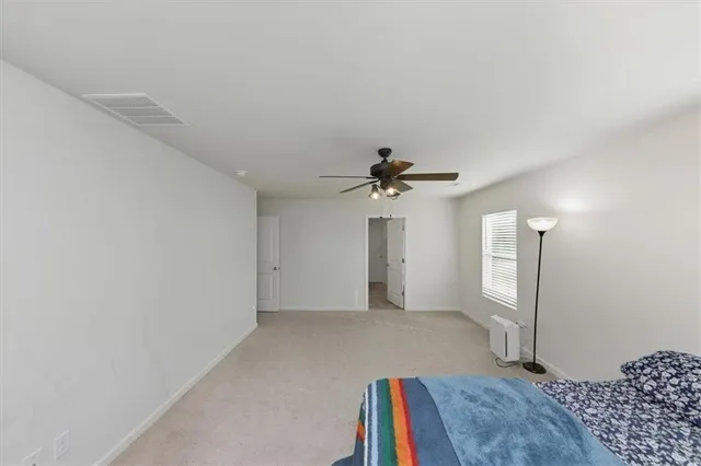 a white refrigerator freezer and a white kitchen