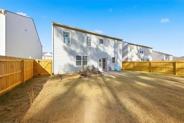 a view of yard with large trees