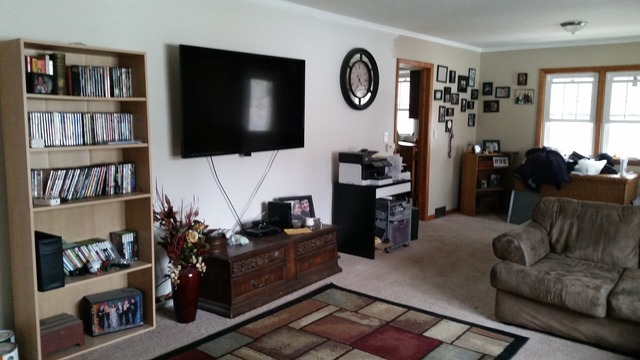 2128 Pleasure View Road Aurora, IL 60506 - Photo 2 of 10 a living room with furniture and a flat screen tv