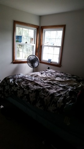 2128 Pleasure View Road Aurora, IL 60506 - Photo 7 of 10 a bedroom with a bed stove and window