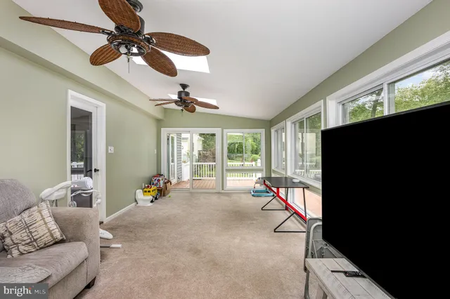 a living room with furniture and windows