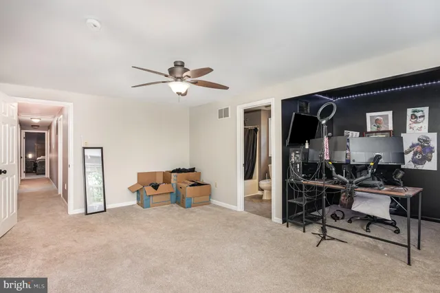 a view of room with workspace and windows