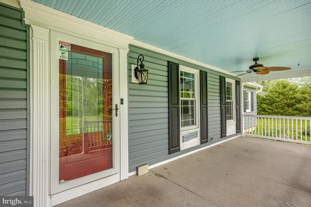 a kitchen with a sink a stove and cabinets