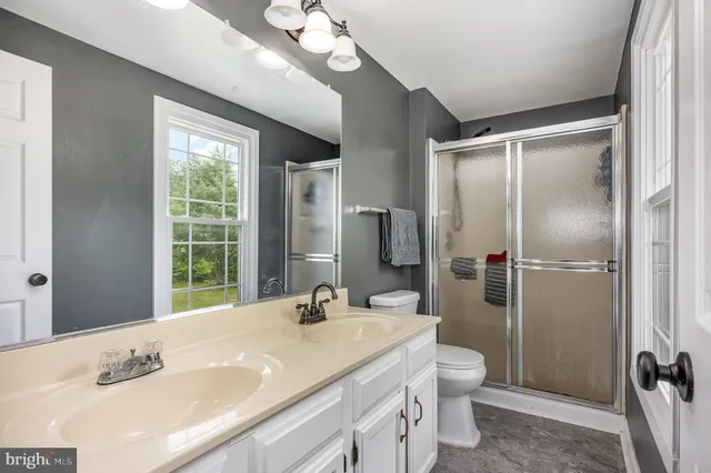 a bed room with a bed and a window