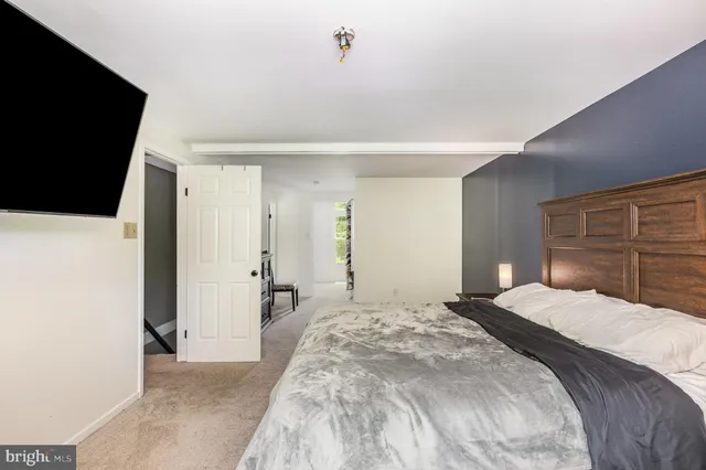 a view of a livingroom with furniture and a window