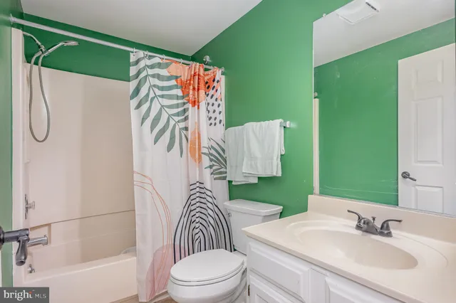 a sitting area with pool table