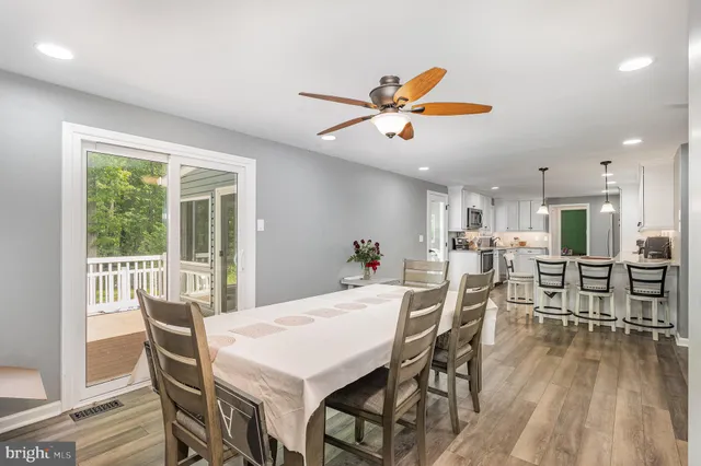 a kitchen with white cabinets and appliances