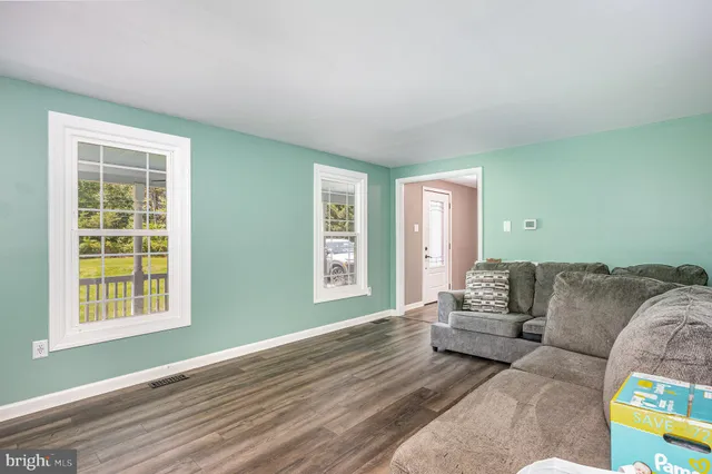 a living room with furniture and a couch