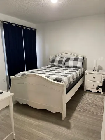 a large bed sitting in a bedroom and closet