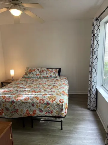 a bedroom with a bed and a fireplace