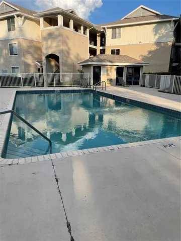 a view of a lake with a building in the background