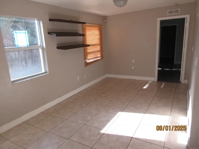 a view of an empty room and window