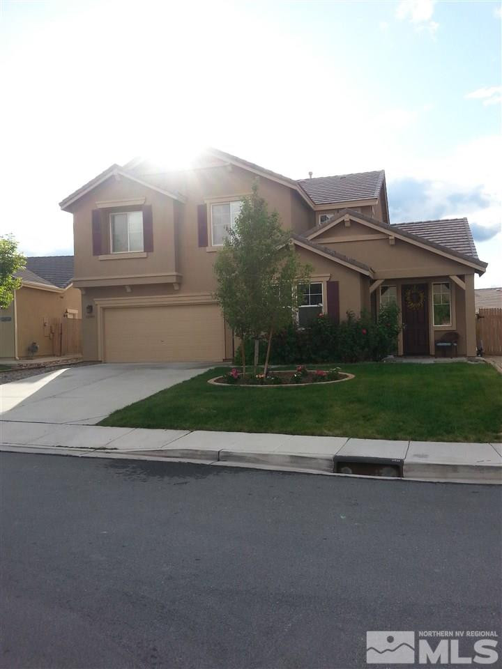 10505 Fort Morgan Way Reno, NV 89521 - Photo 1 of 1 a view of a house with a yard and potted plants