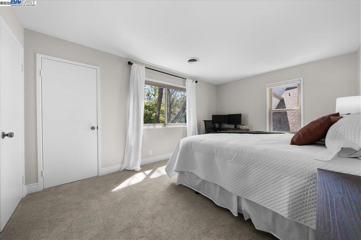 427 Chalda Way Moraga, CA 94556 - Photo 11 of 31 Generously sized room with serene views of lush treetops, offering a peaceful retreat.
