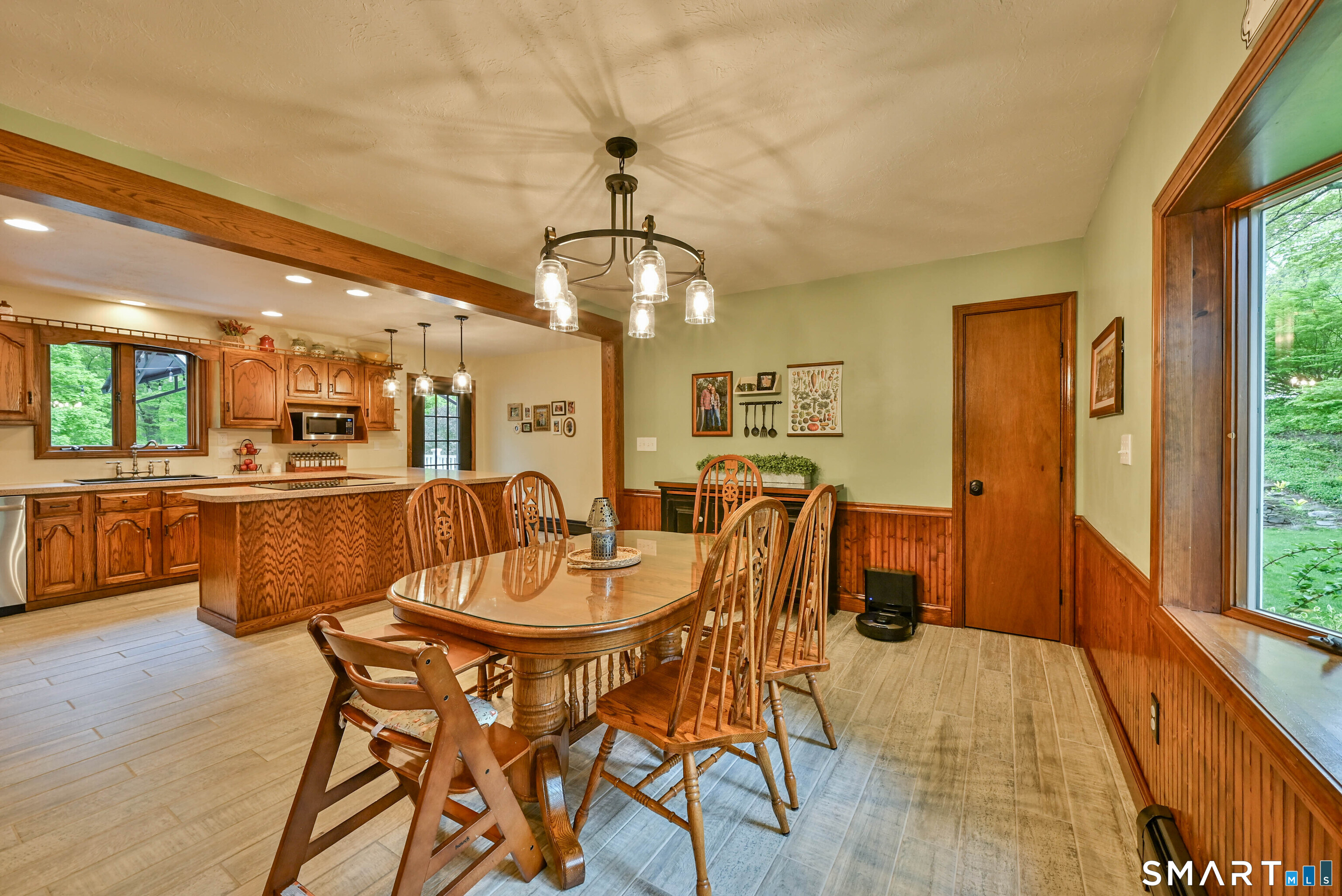 309 O'Leary Road Thompson, CT 06277 - Photo 21 of 40 a dining room with furniture a chandelier and wooden floor