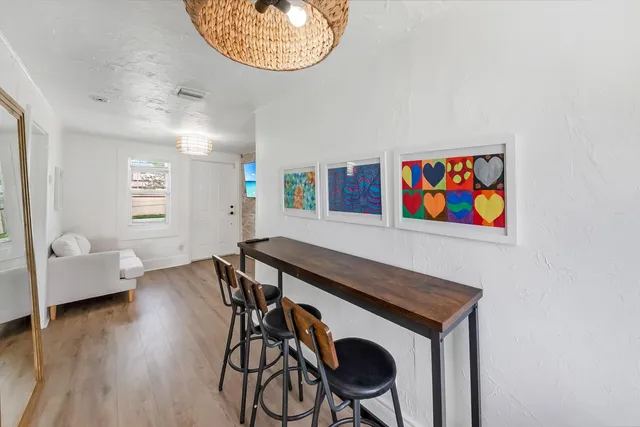 a view of a livingroom with furniture and wooden floor