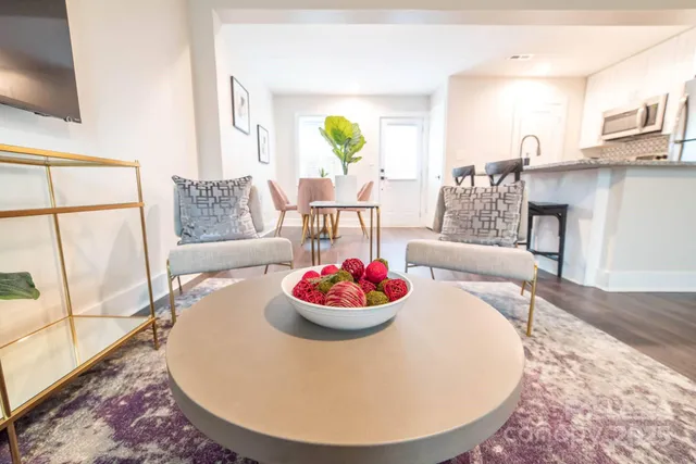 a living room with furniture and a table
