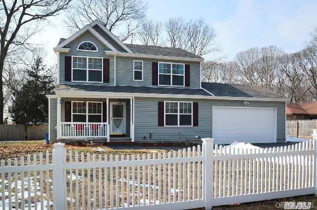 14 Forest Road Centereach, NY 11720 - Photo 1 of 1 a front view of a house with a yard