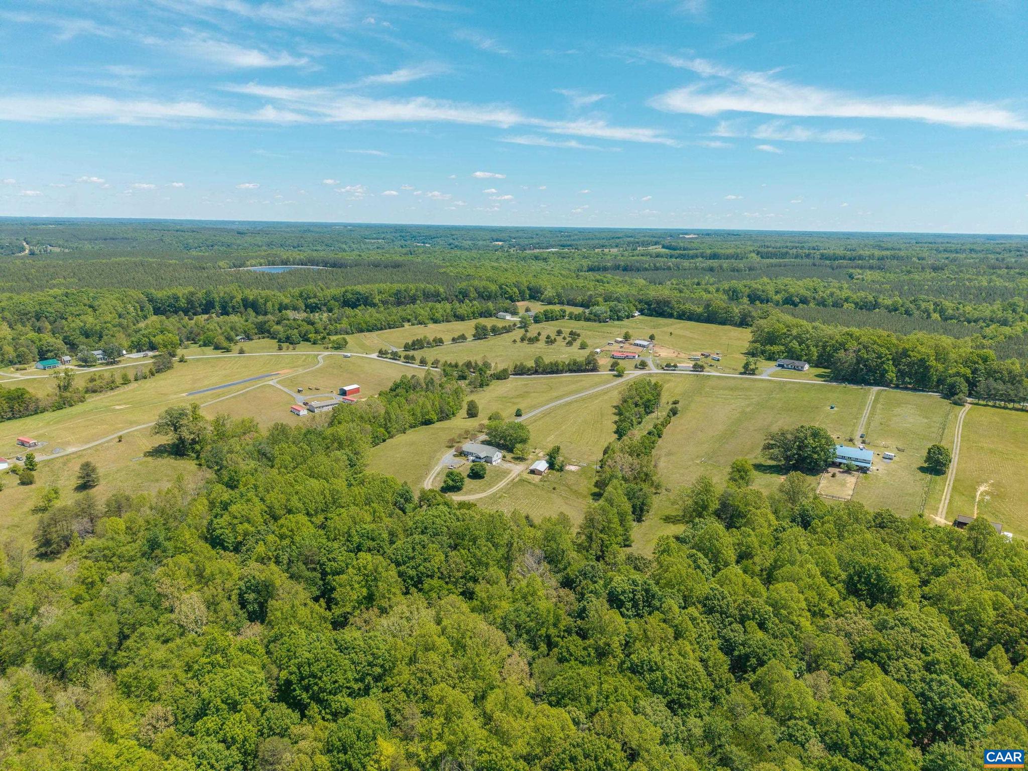 1075 Social Hall Road New Canton, VA 23123 - Photo 40 of 64 an aerial view of ocean with residential houses with outdoor space and trees