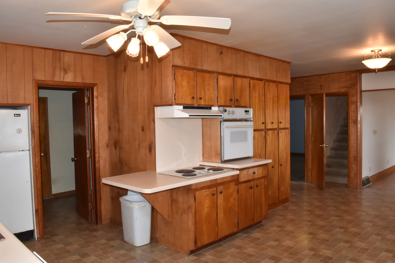 13801 Lister Road Morrison, IL 61270 - Photo 3 of 30 a kitchen with stainless steel appliances a stove and a refrigerator