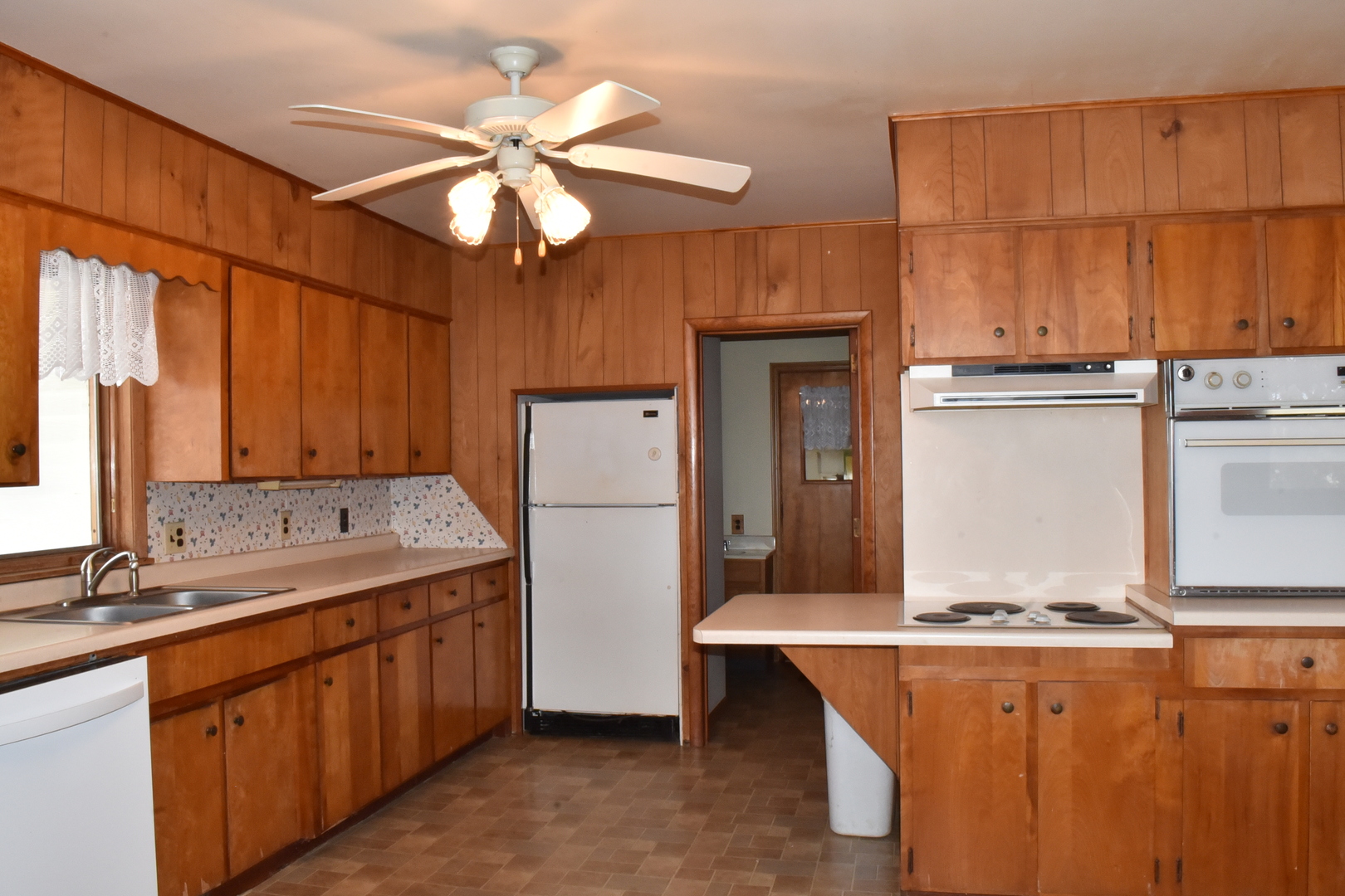13801 Lister Road Morrison, IL 61270 - Photo 4 of 30 a kitchen with a refrigerator and a sink