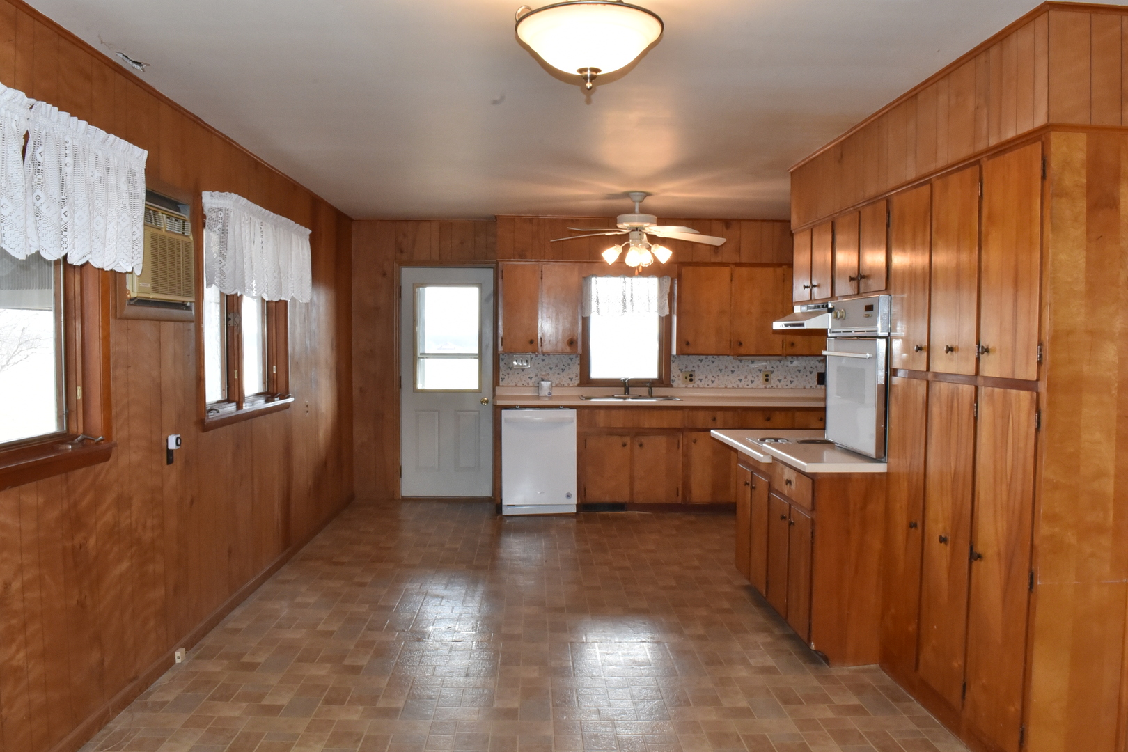 13801 Lister Road Morrison, IL 61270 - Photo 5 of 30 a kitchen with stainless steel appliances granite countertop a refrigerator a sink dishwasher a stove and a refrigerator with wooden floor