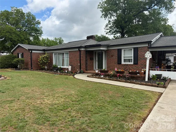a front view of house with yard patio and green space