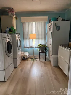 a view of a room with washer and dryer