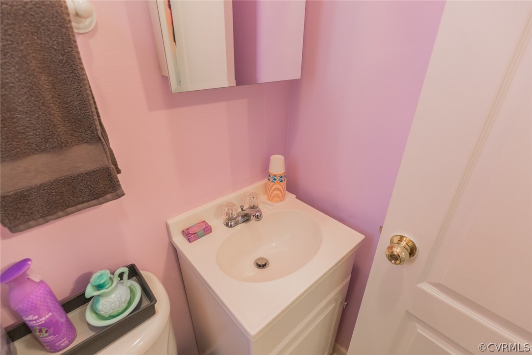 7404 Biscayne Road Henrico, VA 23294 - Photo 16 of 22 The handy powder bathroom is perfect for your gues