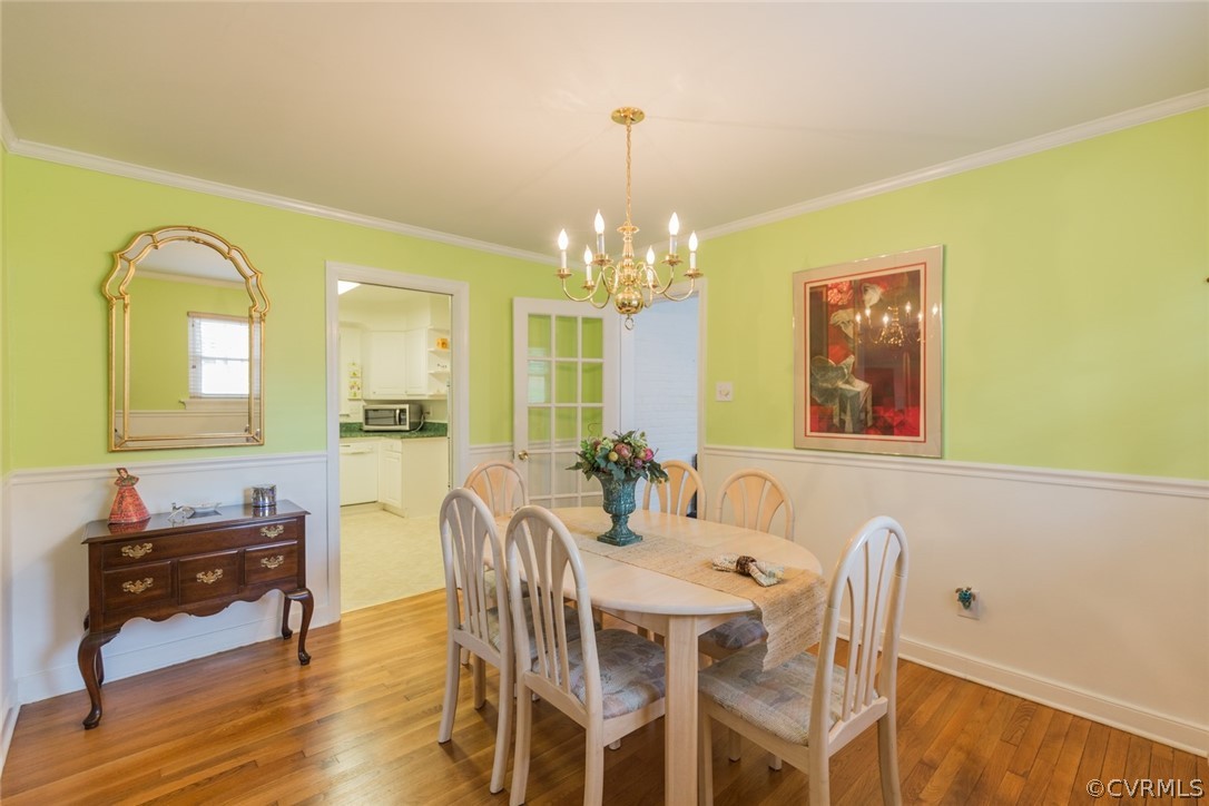 7404 Biscayne Road Henrico, VA 23294 - Photo 6 of 22 Lovely dining room with hardwood floor, chandelier
