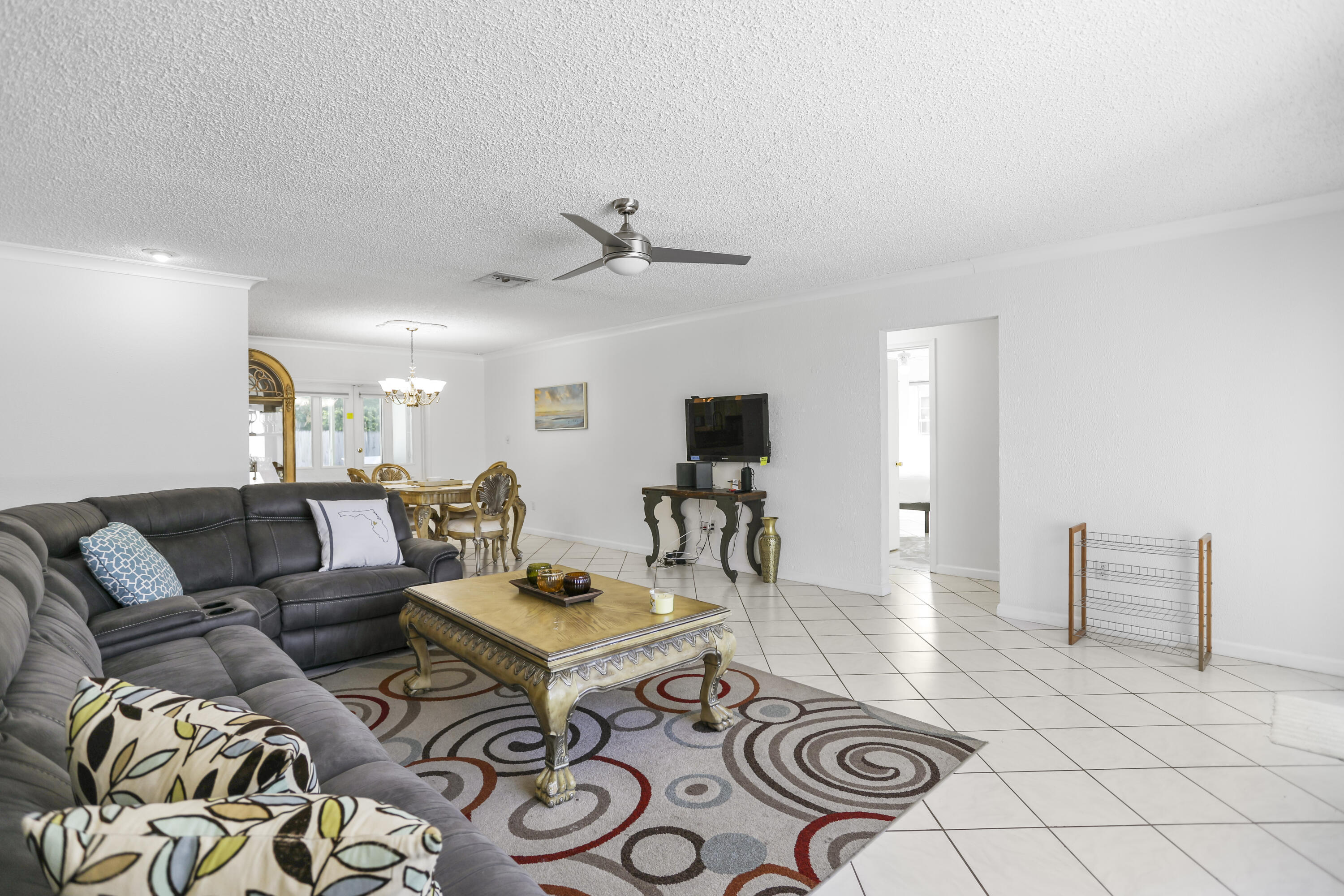 22682 Southwest 65th Avenue Boca Raton, FL 33428 - Photo 12 of 58 a living room with furniture and a rug