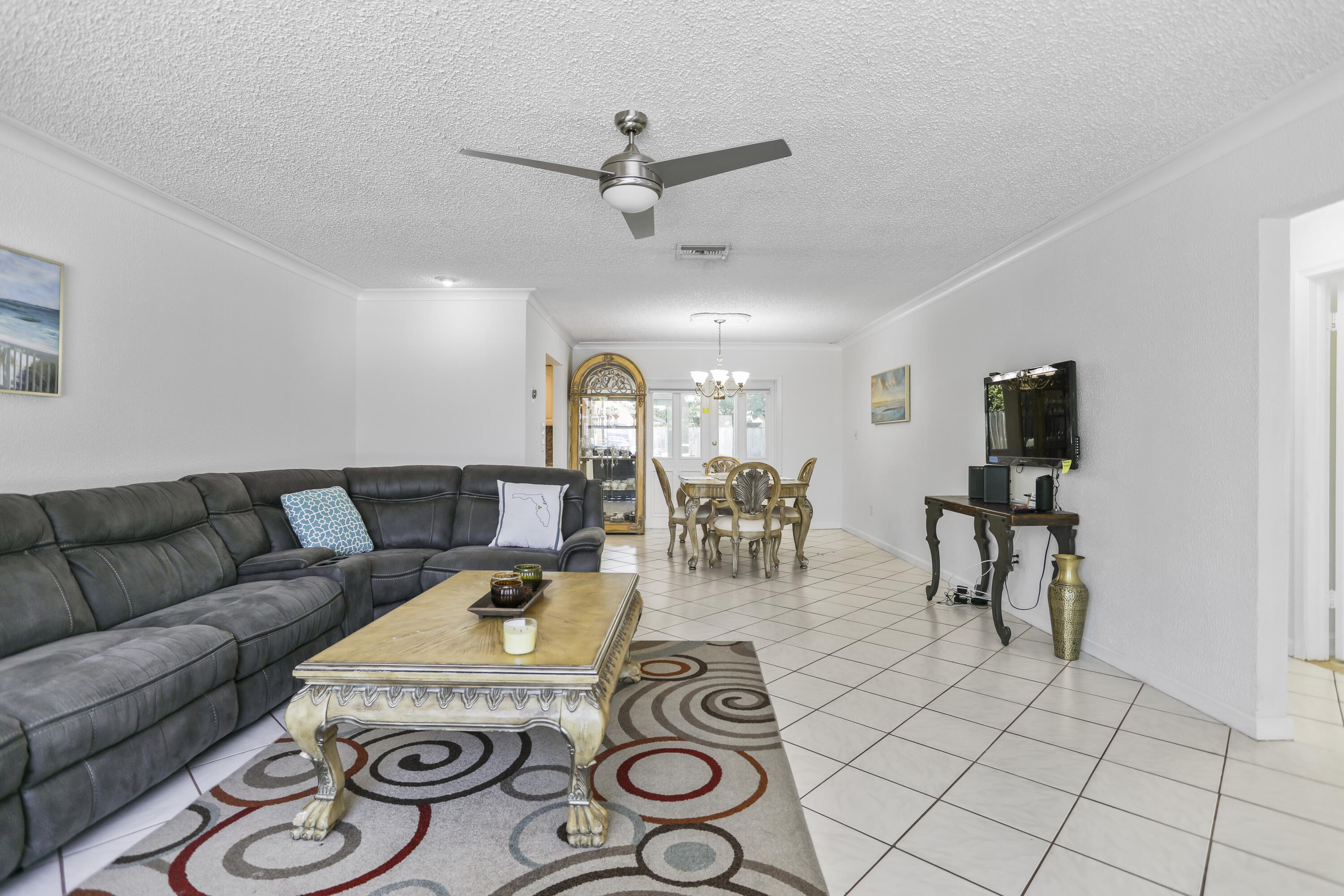 22682 Southwest 65th Avenue Boca Raton, FL 33428 - Photo 18 of 58 a living room with furniture and wooden floor