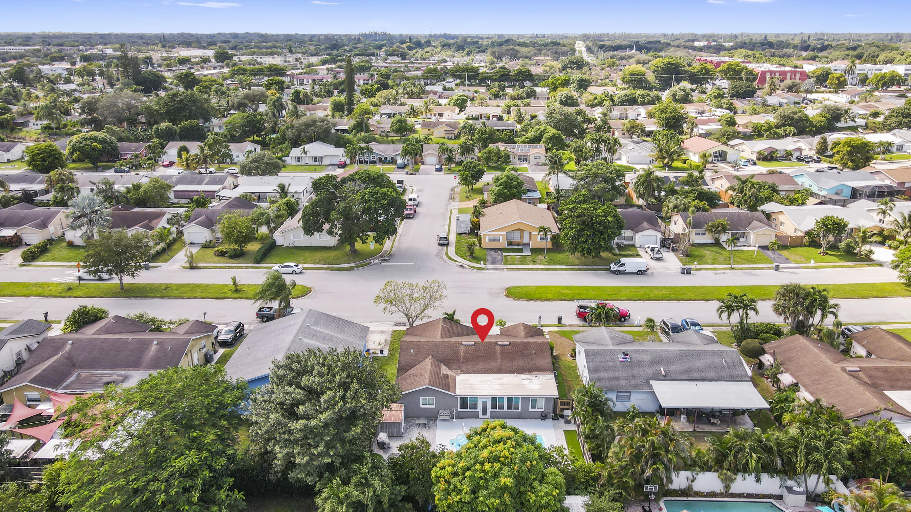 22682 Southwest 65th Avenue Boca Raton, FL 33428 - Photo 2 of 58 an aerial view of residential houses with outdoor space and swimming pool