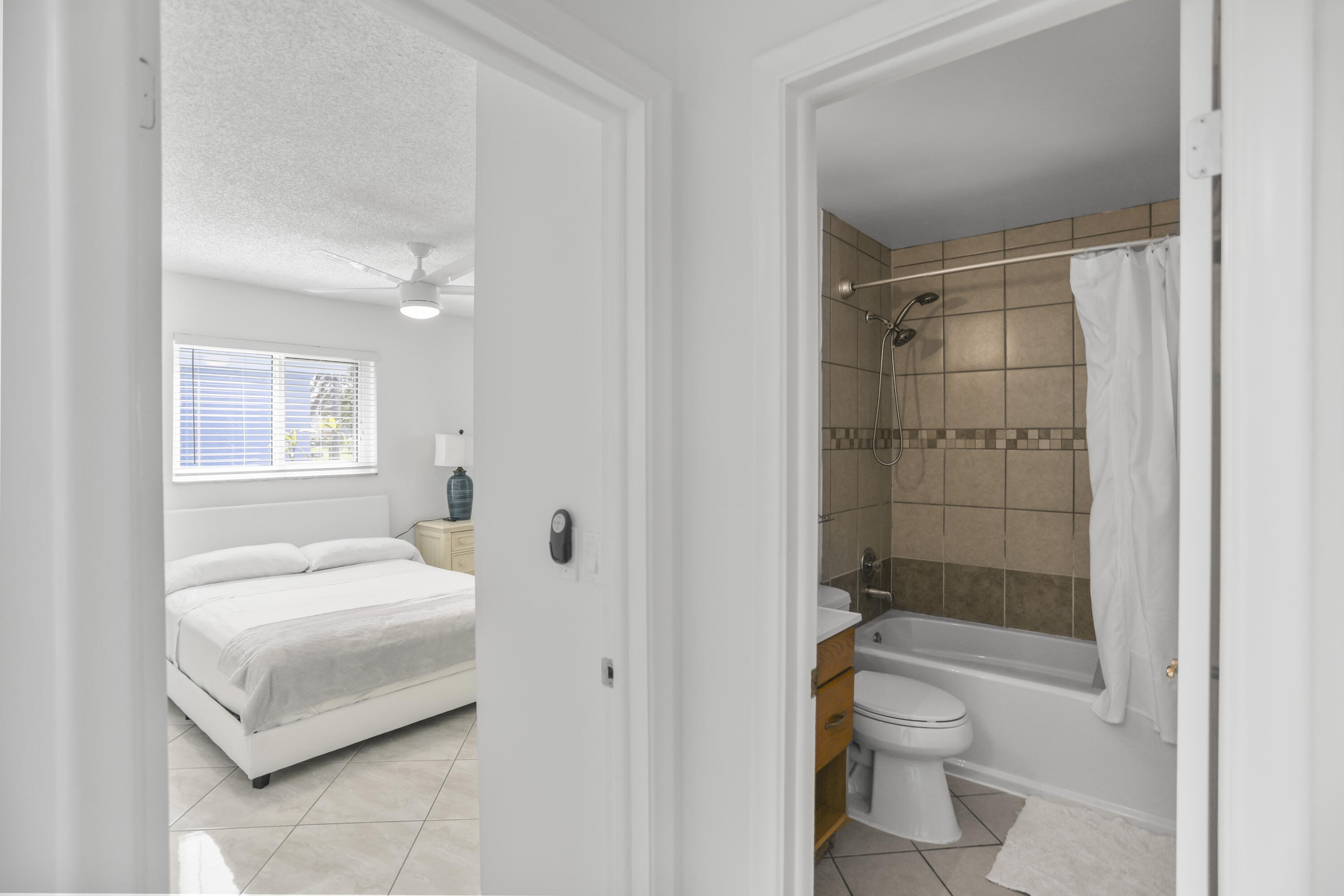 22682 Southwest 65th Avenue Boca Raton, FL 33428 - Photo 21 of 58 a bathroom with a sink toilet and shower