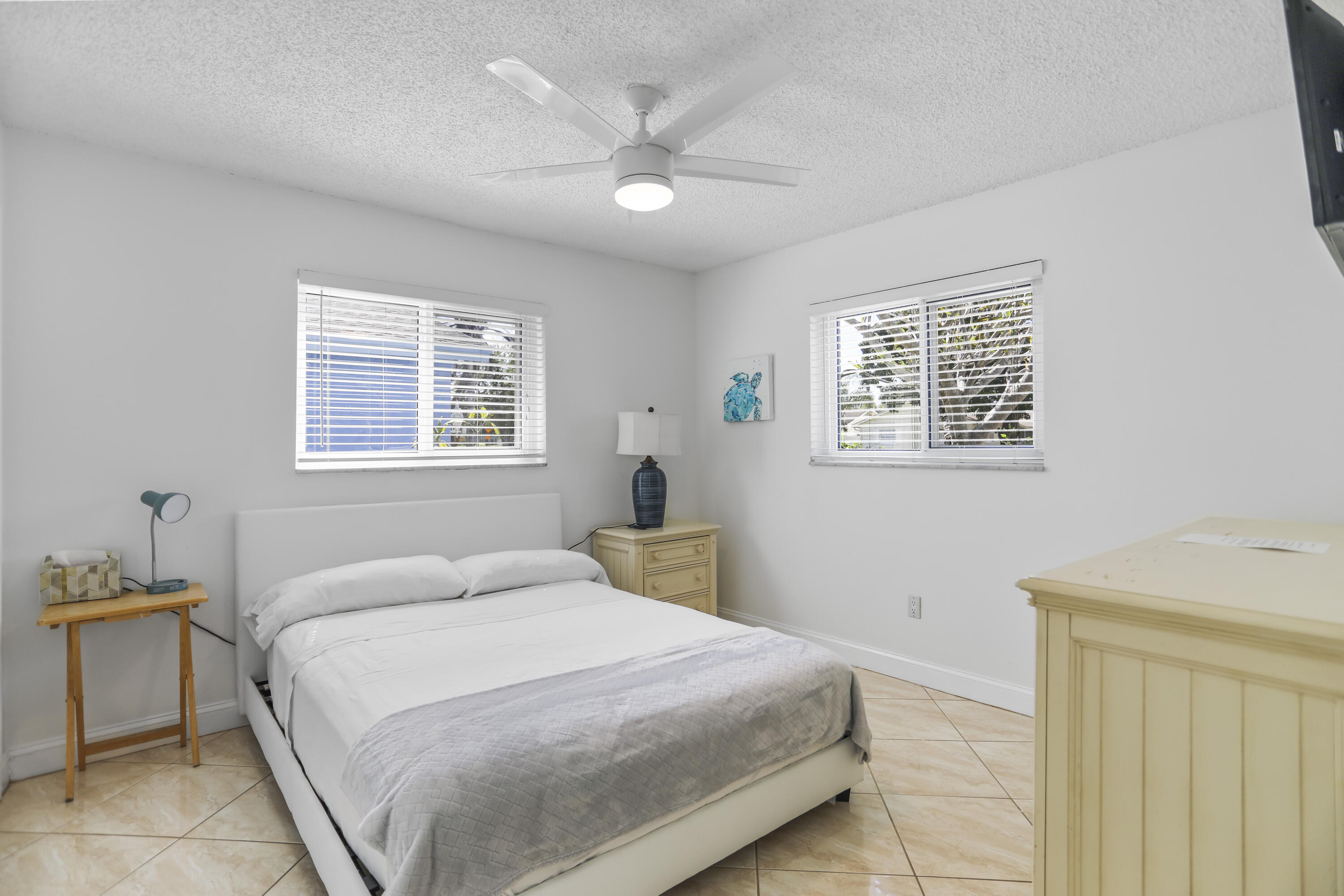 22682 Southwest 65th Avenue Boca Raton, FL 33428 - Photo 29 of 58 a bedroom with a large bed and a window