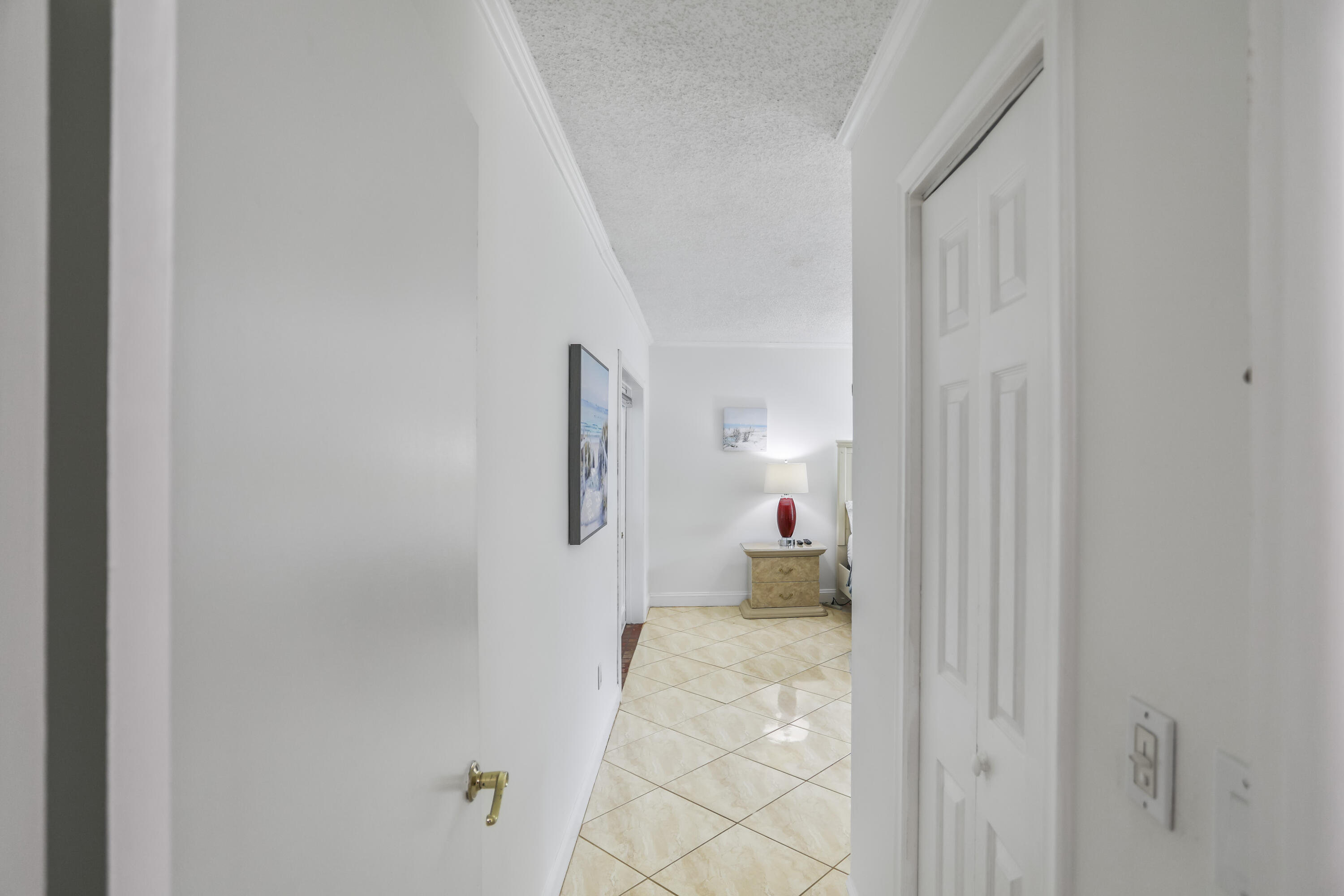 22682 Southwest 65th Avenue Boca Raton, FL 33428 - Photo 36 of 58 a bedroom with a bed and a cabinets