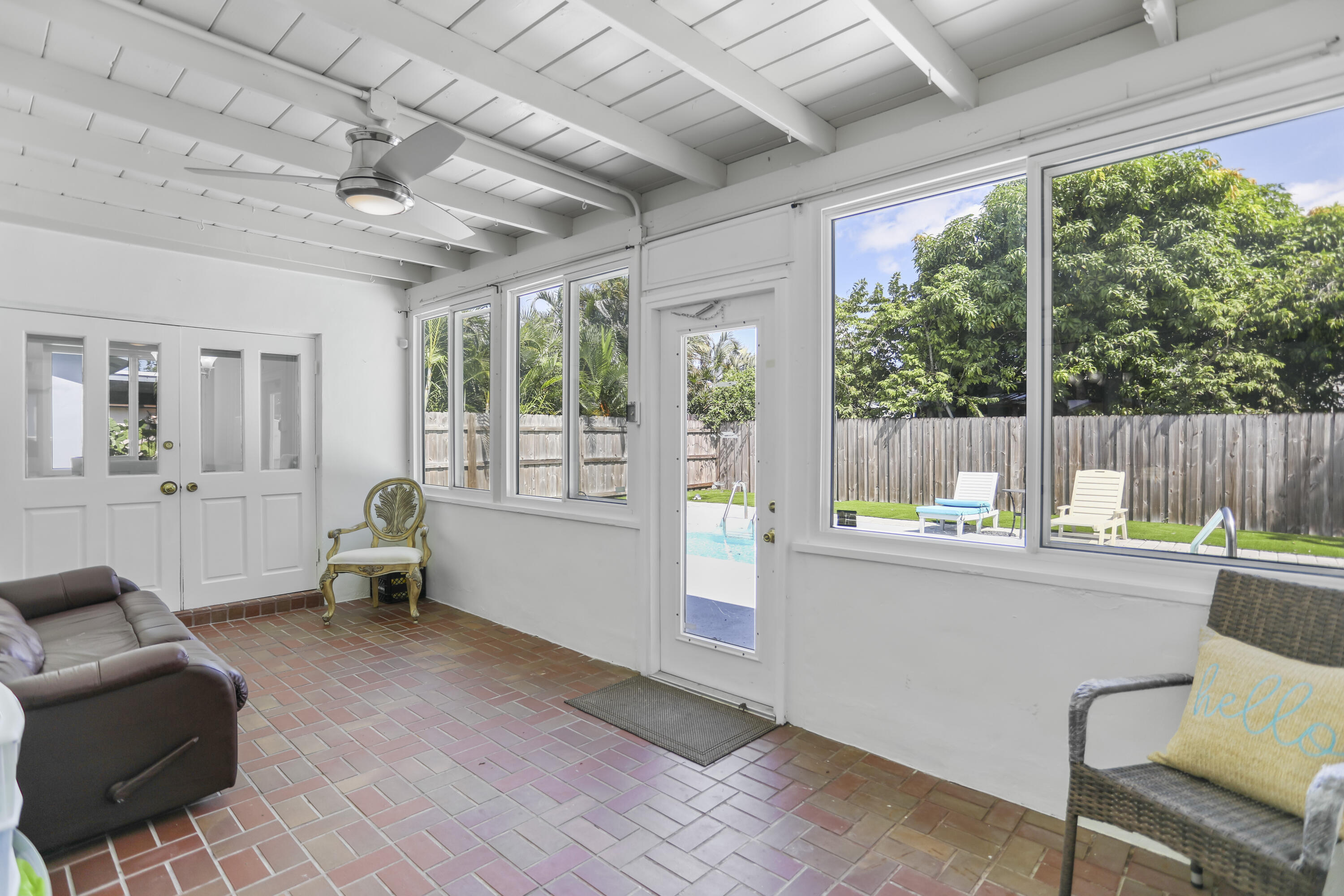 22682 Southwest 65th Avenue Boca Raton, FL 33428 - Photo 44 of 58 a kitchen with furniture and a large window