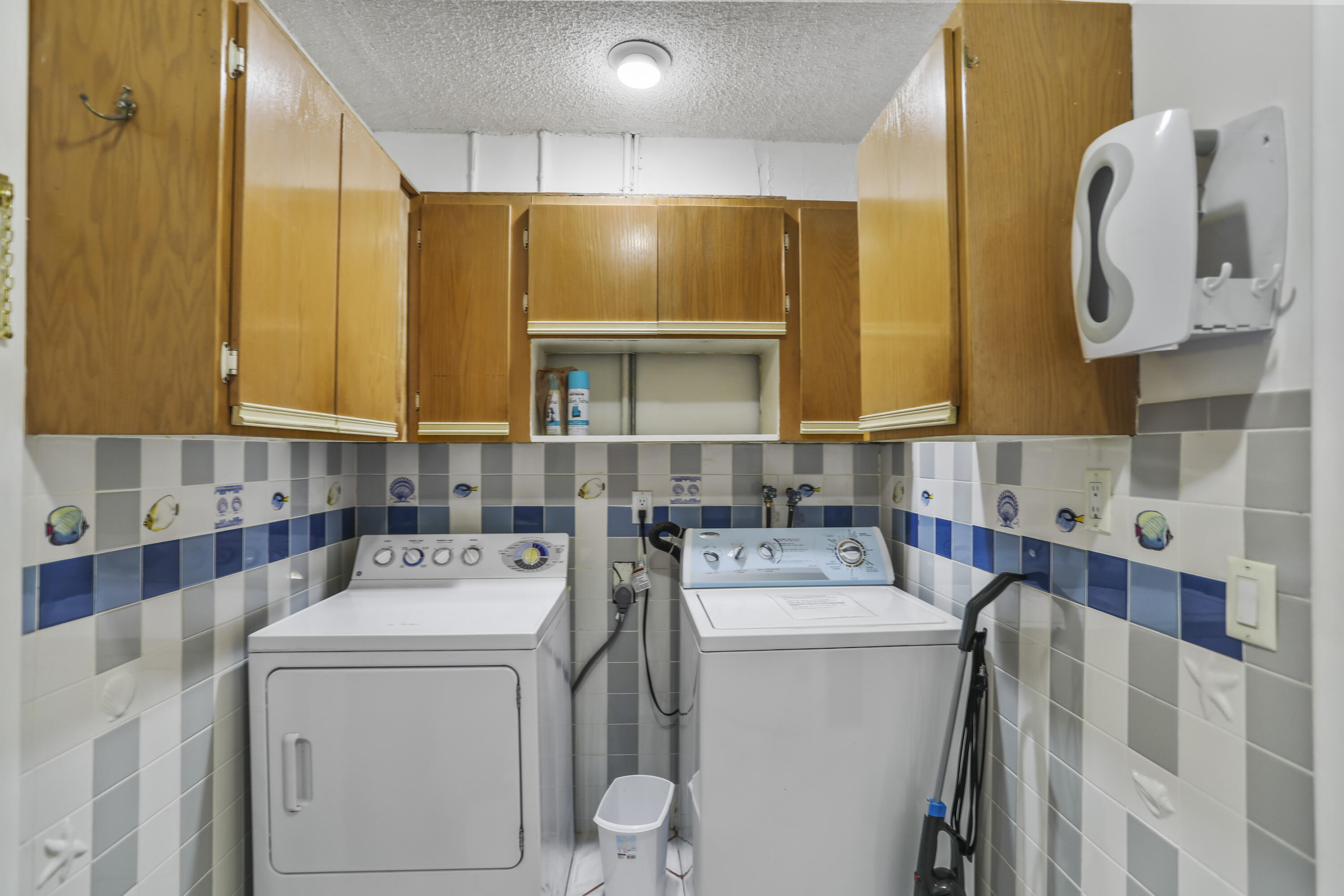 22682 Southwest 65th Avenue Boca Raton, FL 33428 - Photo 53 of 58 a utility room with dryer and washer