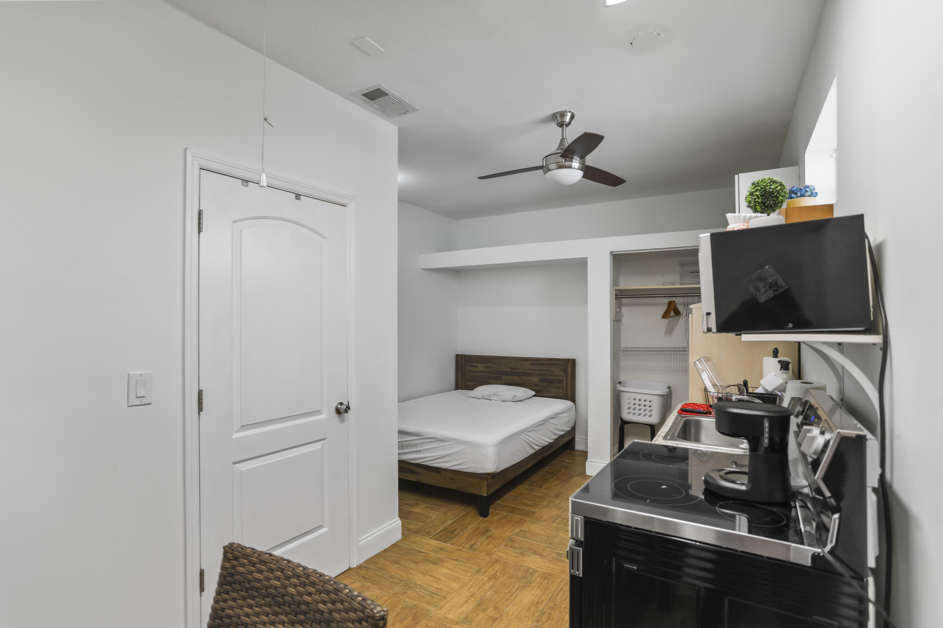 22682 Southwest 65th Avenue Boca Raton, FL 33428 - Photo 55 of 58 a bedroom with furniture and a flat screen tv