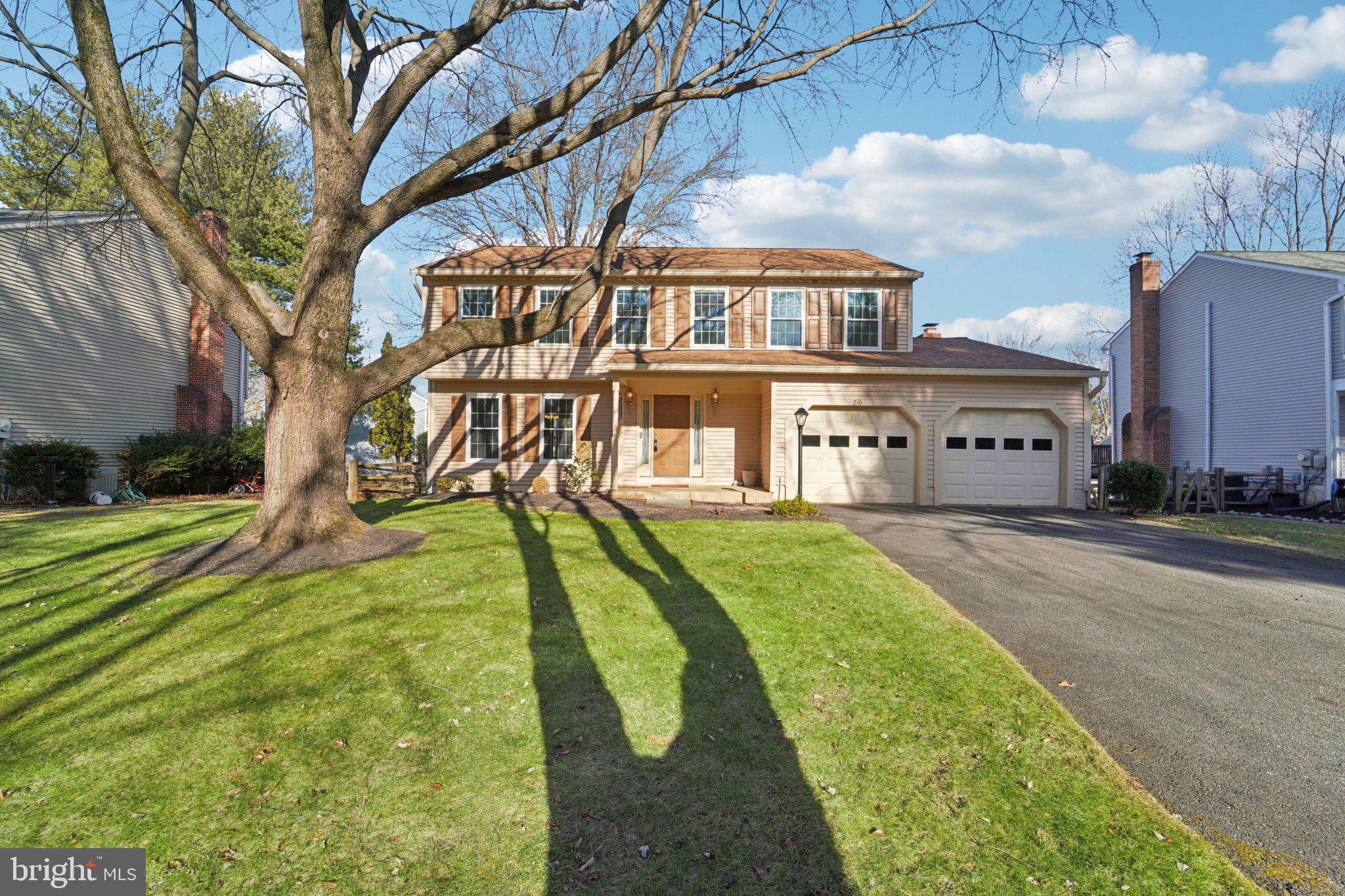 216 Bookham Lane Gaithersburg, MD 20877 - Photo 1 of 49 a view of a white house with a big yard plants and large trees