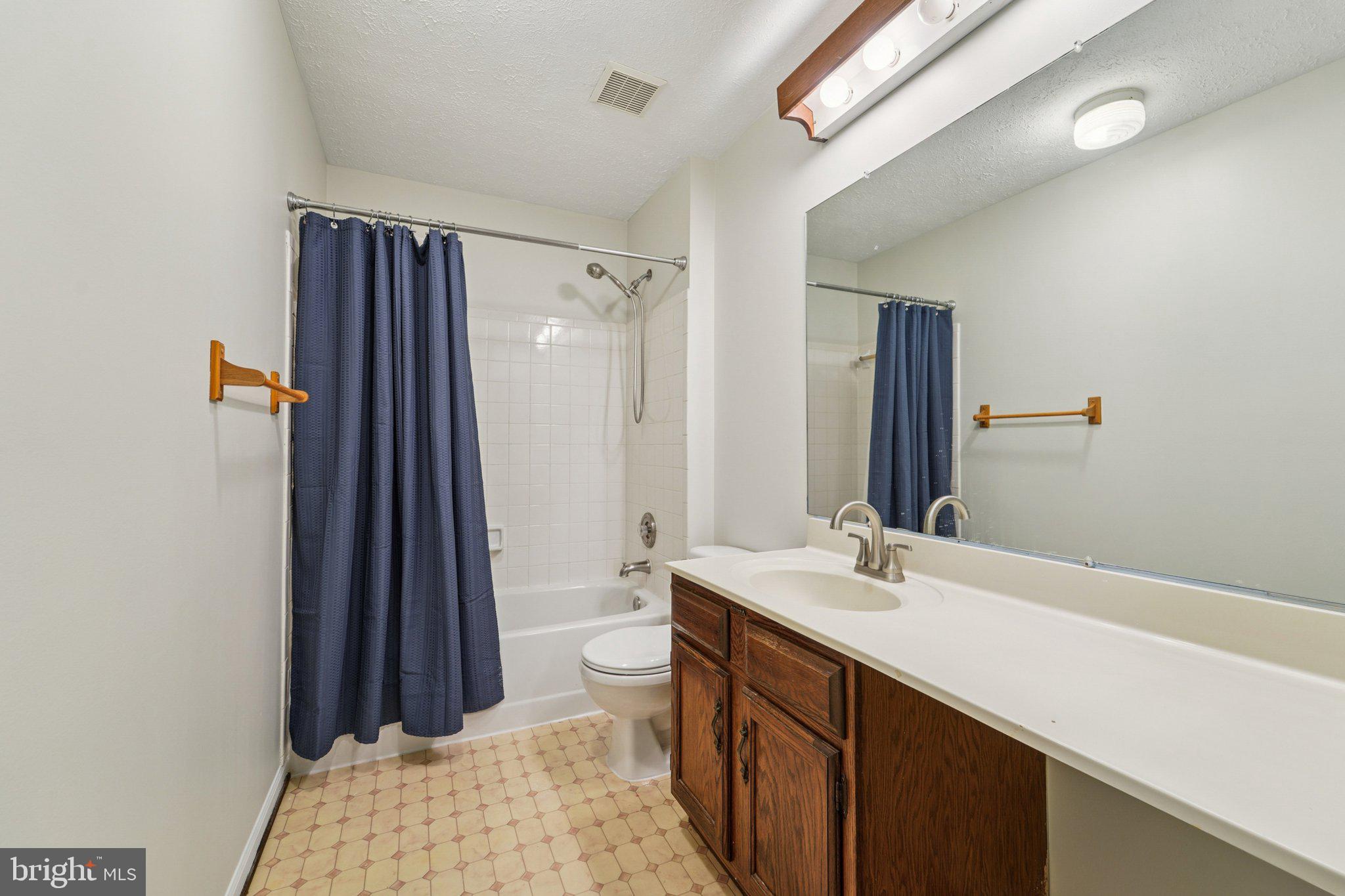 216 Bookham Lane Gaithersburg, MD 20877 - Photo 20 of 49 a bathroom with a sink and a mirror