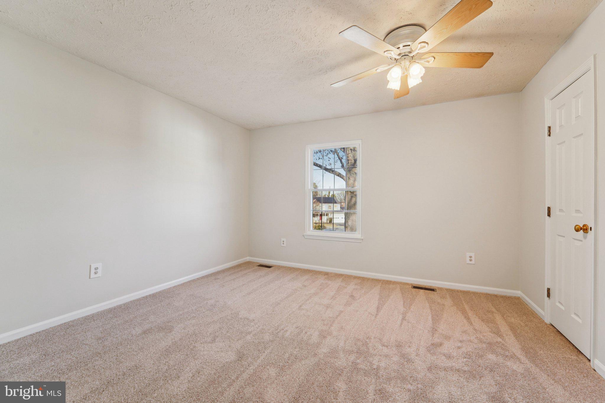216 Bookham Lane Gaithersburg, MD 20877 - Photo 23 of 49 an empty room with windows and fan