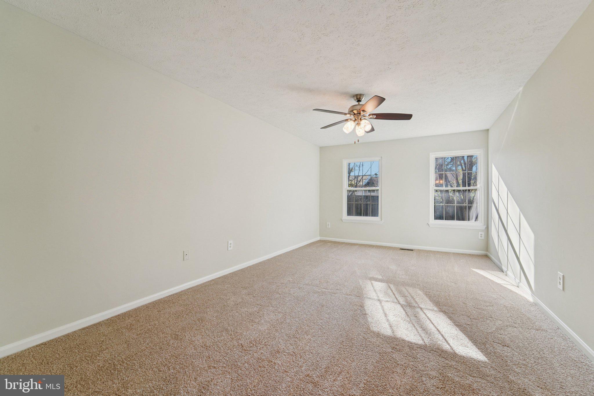 216 Bookham Lane Gaithersburg, MD 20877 - Photo 25 of 49 an empty room with fan and windows
