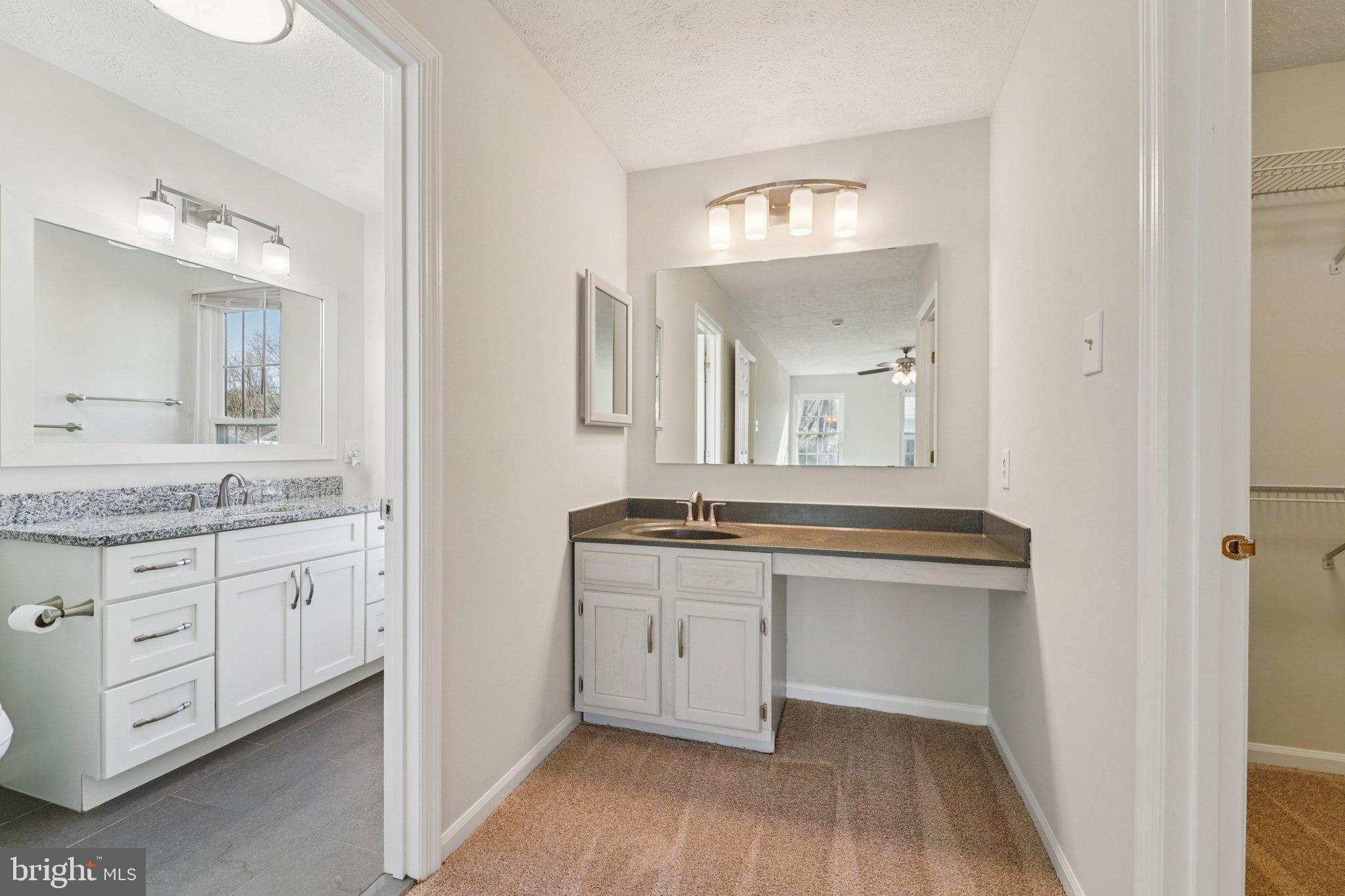 216 Bookham Lane Gaithersburg, MD 20877 - Photo 27 of 49 a bathroom with a granite countertop double vanity sink and a mirror
