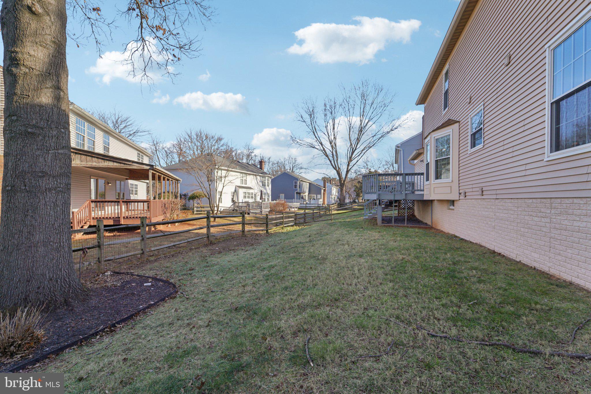216 Bookham Lane Gaithersburg, MD 20877 - Photo 38 of 49 a view of a yard in front of a house