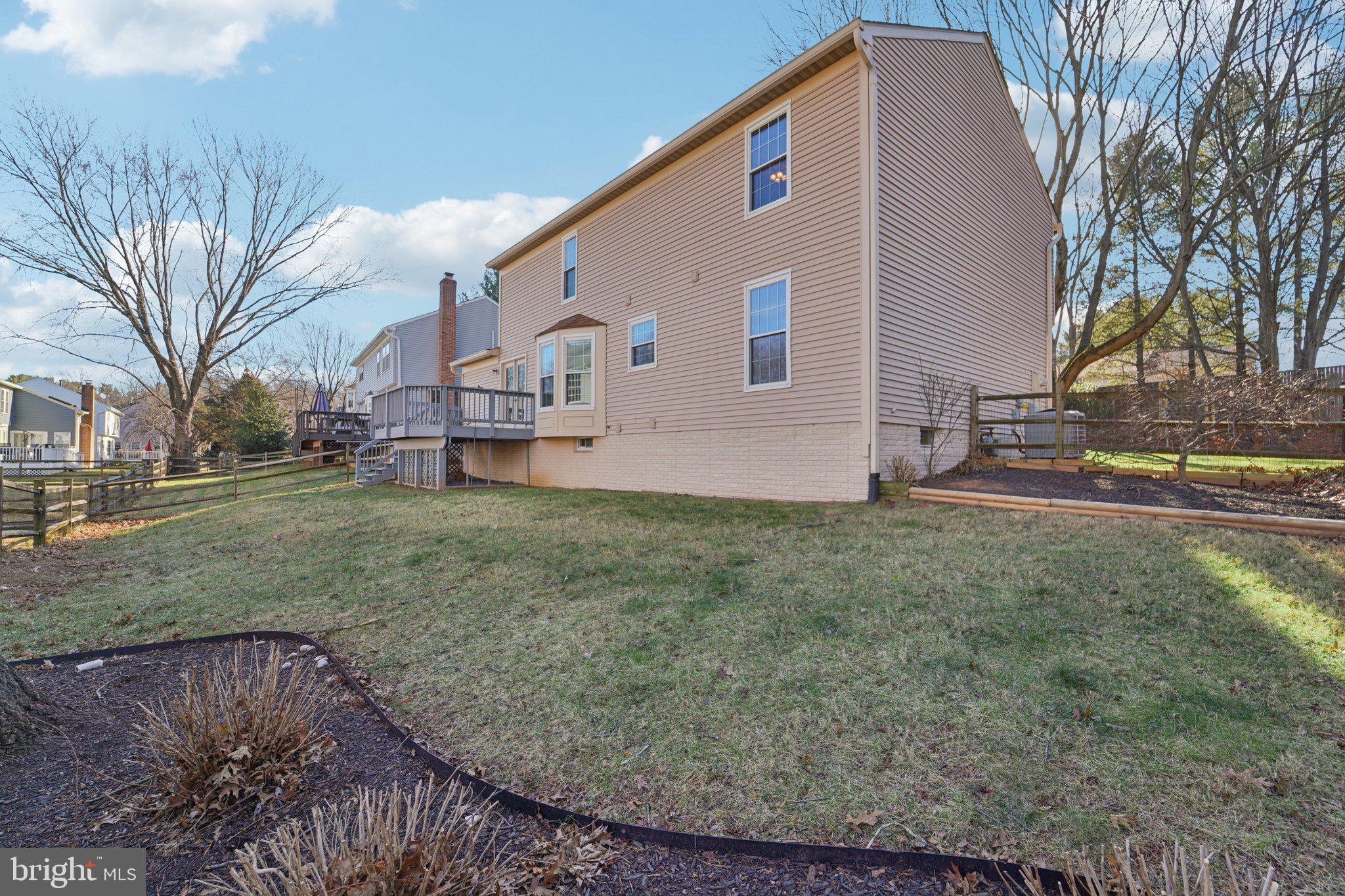 216 Bookham Lane Gaithersburg, MD 20877 - Photo 47 of 49 a backyard of a house with table and chairs