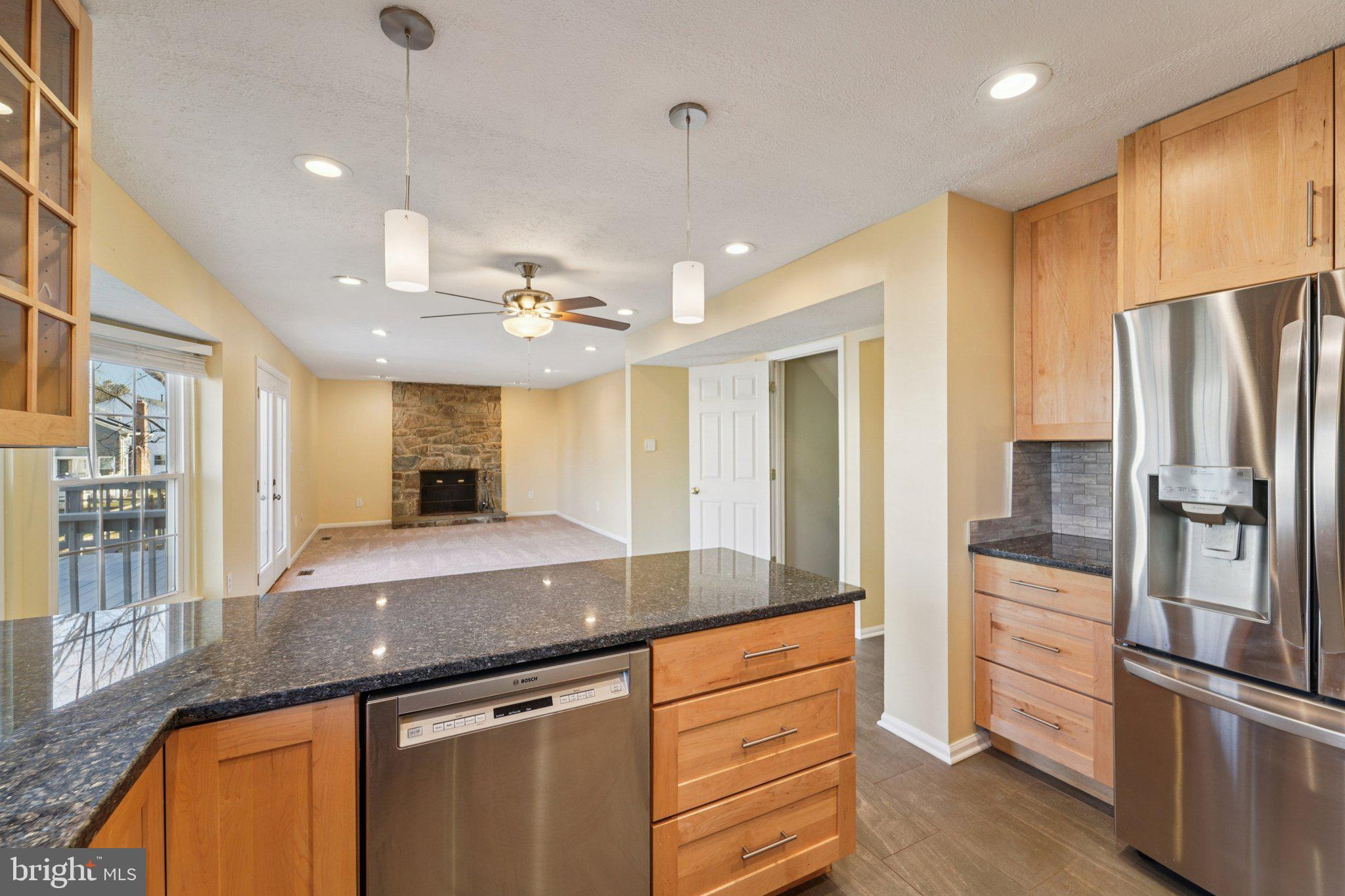 216 Bookham Lane Gaithersburg, MD 20877 - Photo 48 of 49 a kitchen with stainless steel appliances granite countertop a sink and refrigerator