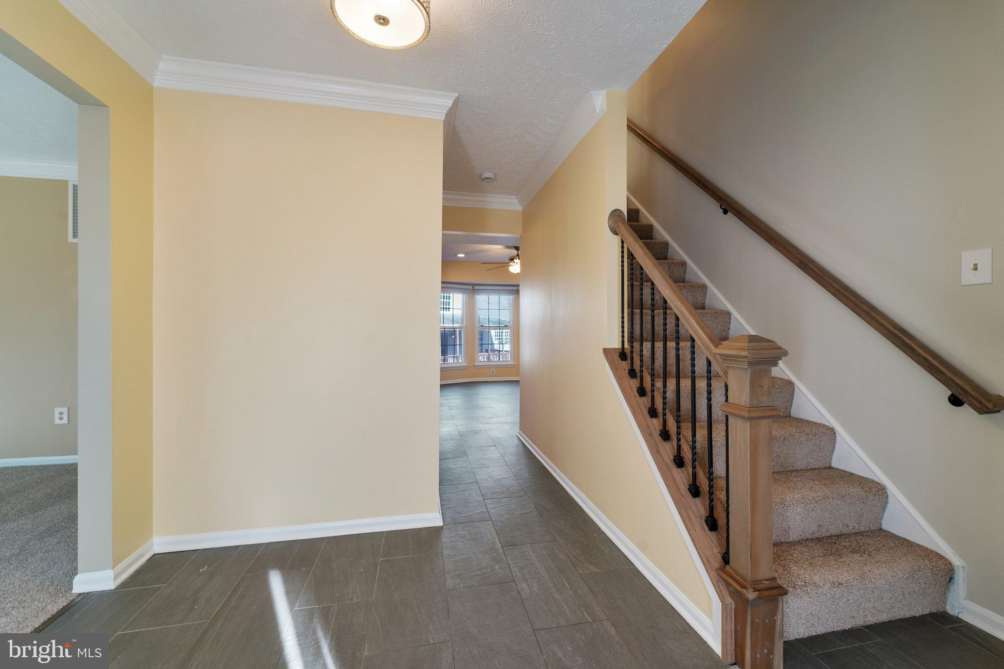 216 Bookham Lane Gaithersburg, MD 20877 - Photo 49 of 49 a view of a hallway with wooden floor and entryway