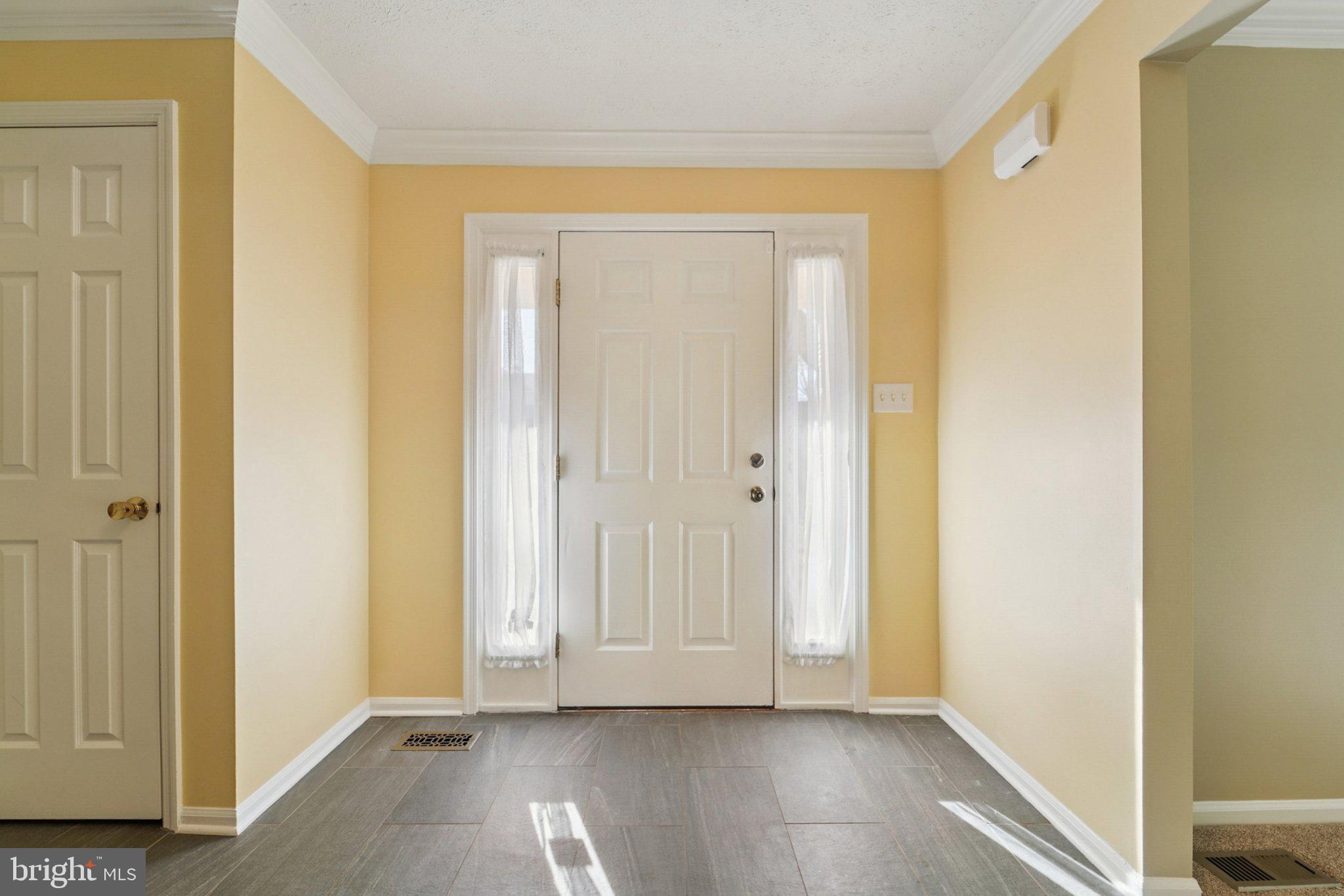 216 Bookham Lane Gaithersburg, MD 20877 - Photo 8 of 49 a view of an empty room with wooden door