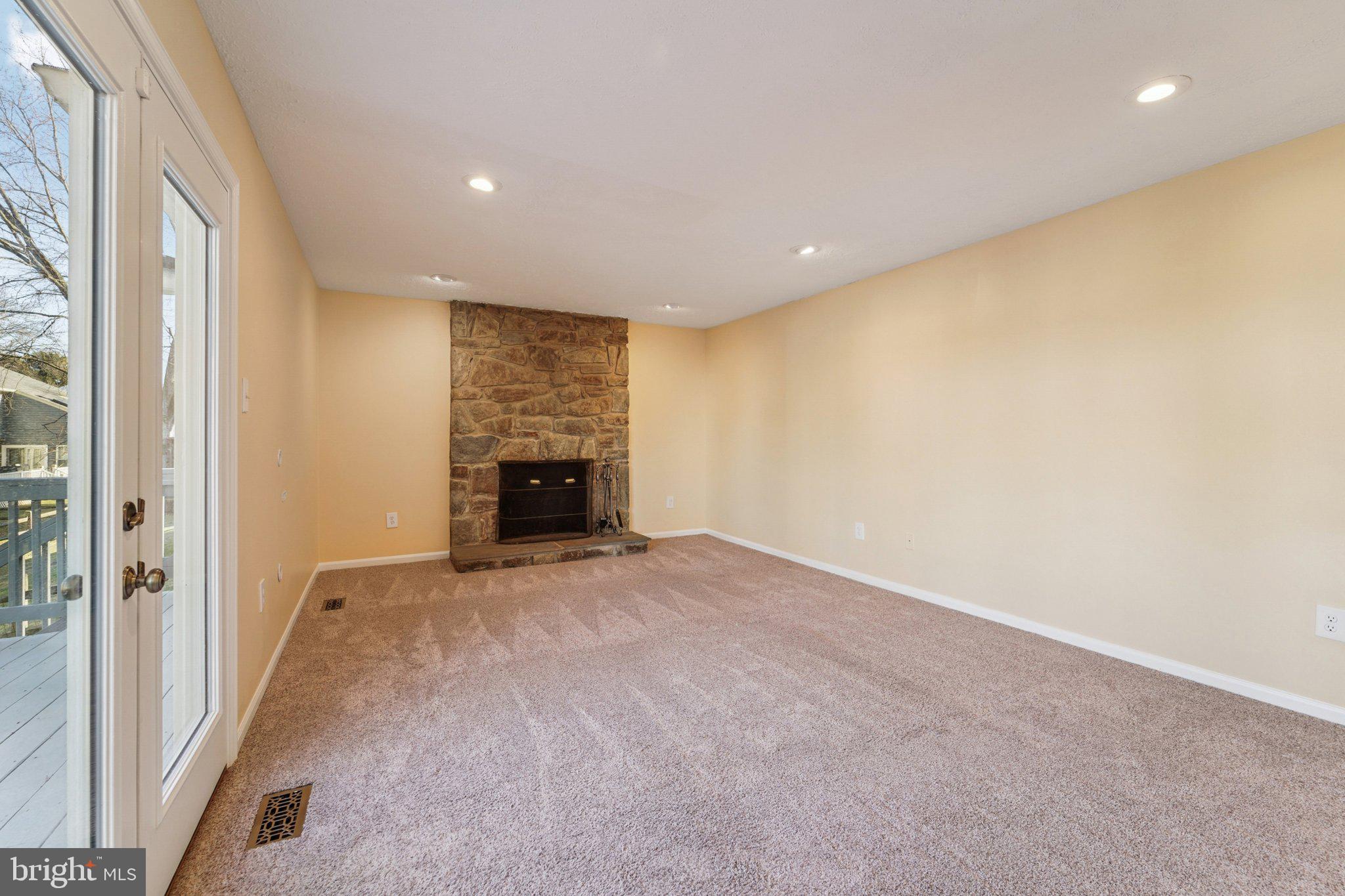 216 Bookham Lane Gaithersburg, MD 20877 - Photo 10 of 49 a view of an empty room with a fireplace